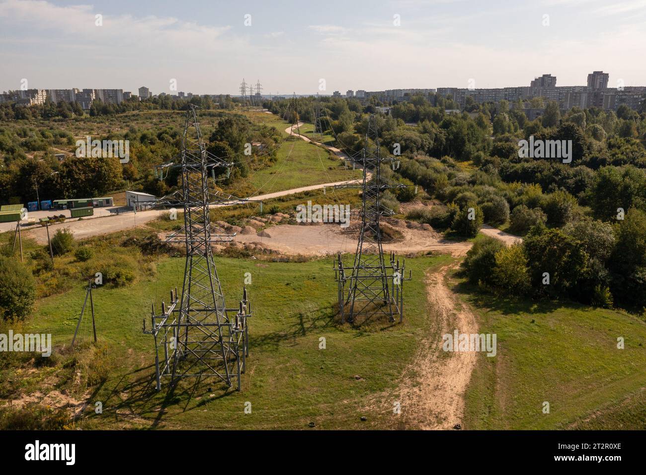 Drone photography of high voltage lines and steel electrical towers during sunny autumn day Stock Photo