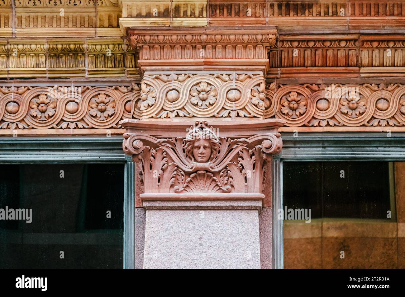 Toronto, Canada, architectural capital in a column of the Hudson Bay building in Yonge St. Intricacy decoration with a small gargoyle sculpture Stock Photo