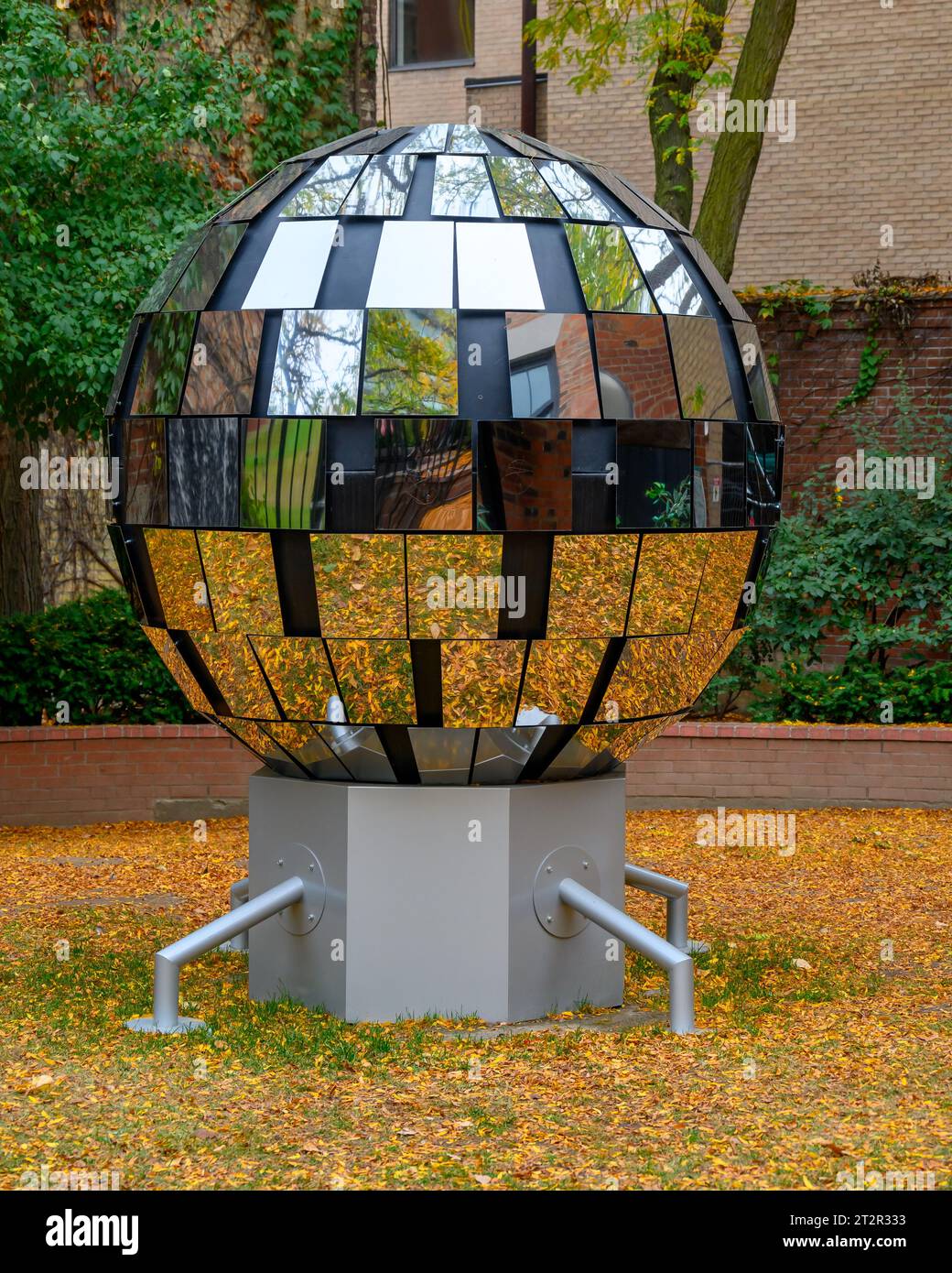 Toronto, Canada, work of art consisting on a sphere covered in pieces of mirrors. The object is located in the Toronto Sculpture Garden in 115 King St Stock Photo