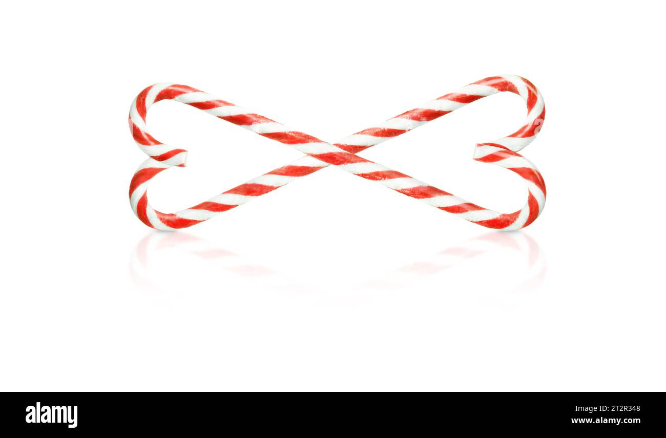 Christmas candy canes weave in hearts isolated on white background Stock Photo