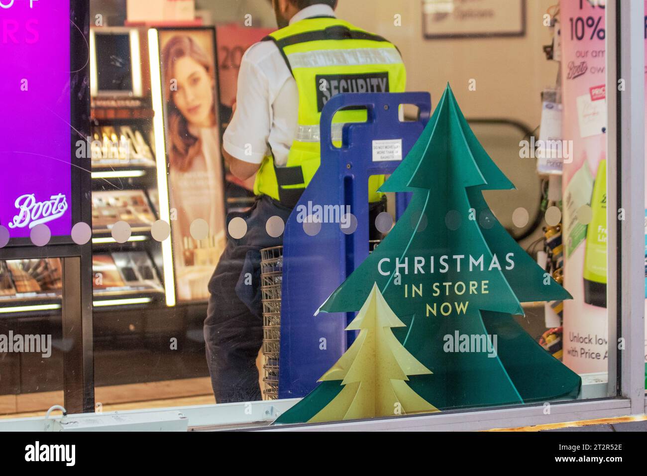 Boots in store Christmas shoplifting.  Shopping centre security cost of living crisis security patrol in Preston, UK Stock Photo