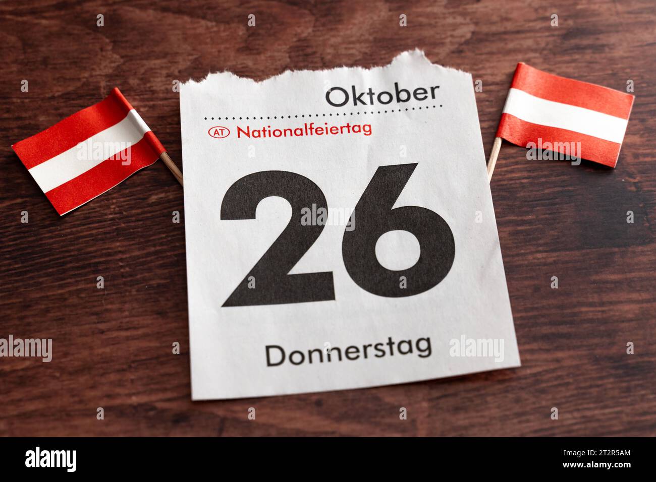 Calendar page with October 26, national holiday in, Austria. 21st Oct, 2023. together with two Austrian flags on a wooden table *** Kalenderblatt mit dem 26. Oktober, Nationalfeiertag in Österreich zusammen mit zwei österreichischen Flaggen auf einem Holztisch Credit: Imago/Alamy Live News Stock Photo