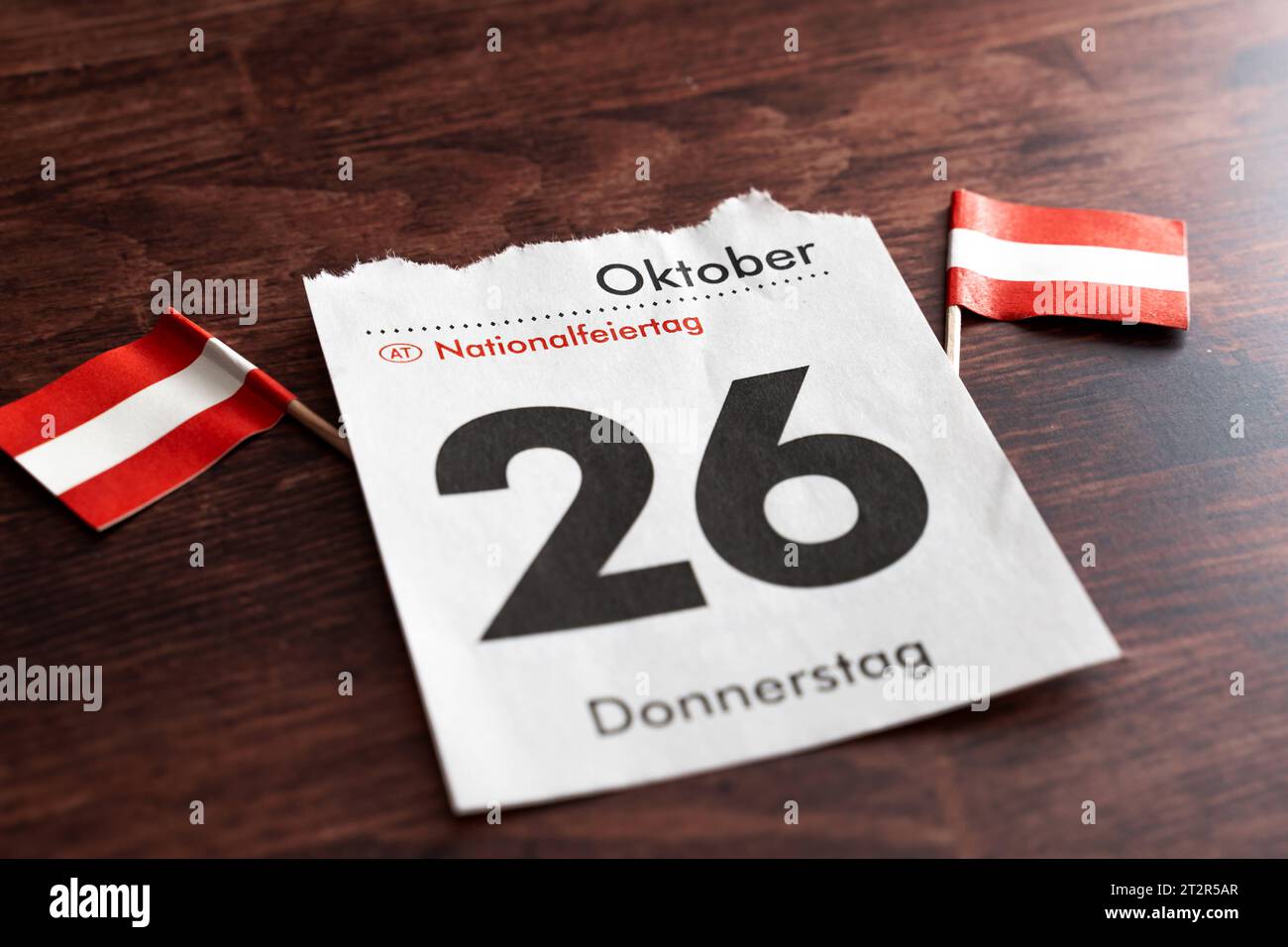 Calendar page with October 26, national holiday in, Austria. 21st Oct, 2023. together with two Austrian flags on a wooden table *** Kalenderblatt mit dem 26. Oktober, Nationalfeiertag in Österreich zusammen mit zwei österreichischen Flaggen auf einem Holztisch Credit: Imago/Alamy Live News Stock Photo