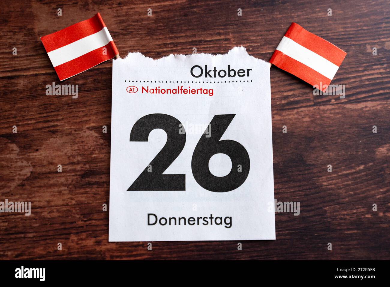 Calendar page with October 26, national holiday in, Austria. 21st Oct, 2023. together with two Austrian flags on a wooden table *** Kalenderblatt mit dem 26. Oktober, Nationalfeiertag in Österreich zusammen mit zwei österreichischen Flaggen auf einem Holztisch Credit: Imago/Alamy Live News Stock Photo