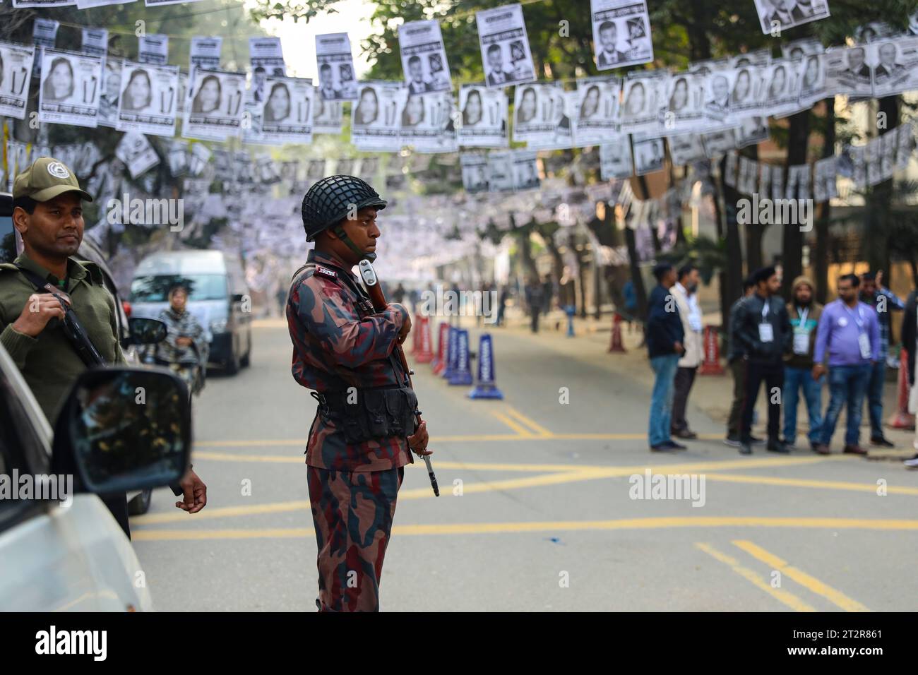 A members of Border Guard Bangladesh (BGB) stand guard on a street during the Dhaka City corporation poll. Dhaka, Bangladesh. Stock Photo