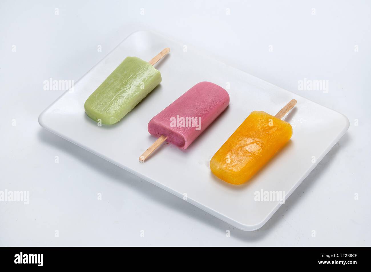 Set of glazed ice cream bars on a stick; various colors, isolated on