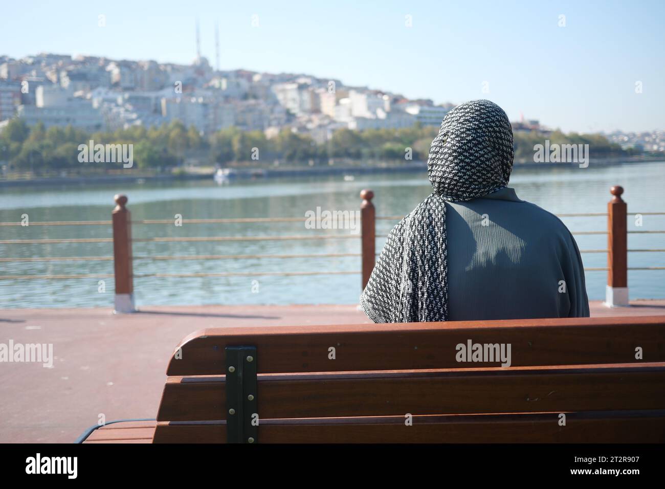 Girl sitting on bench hi-res stock photography and images - Alamy