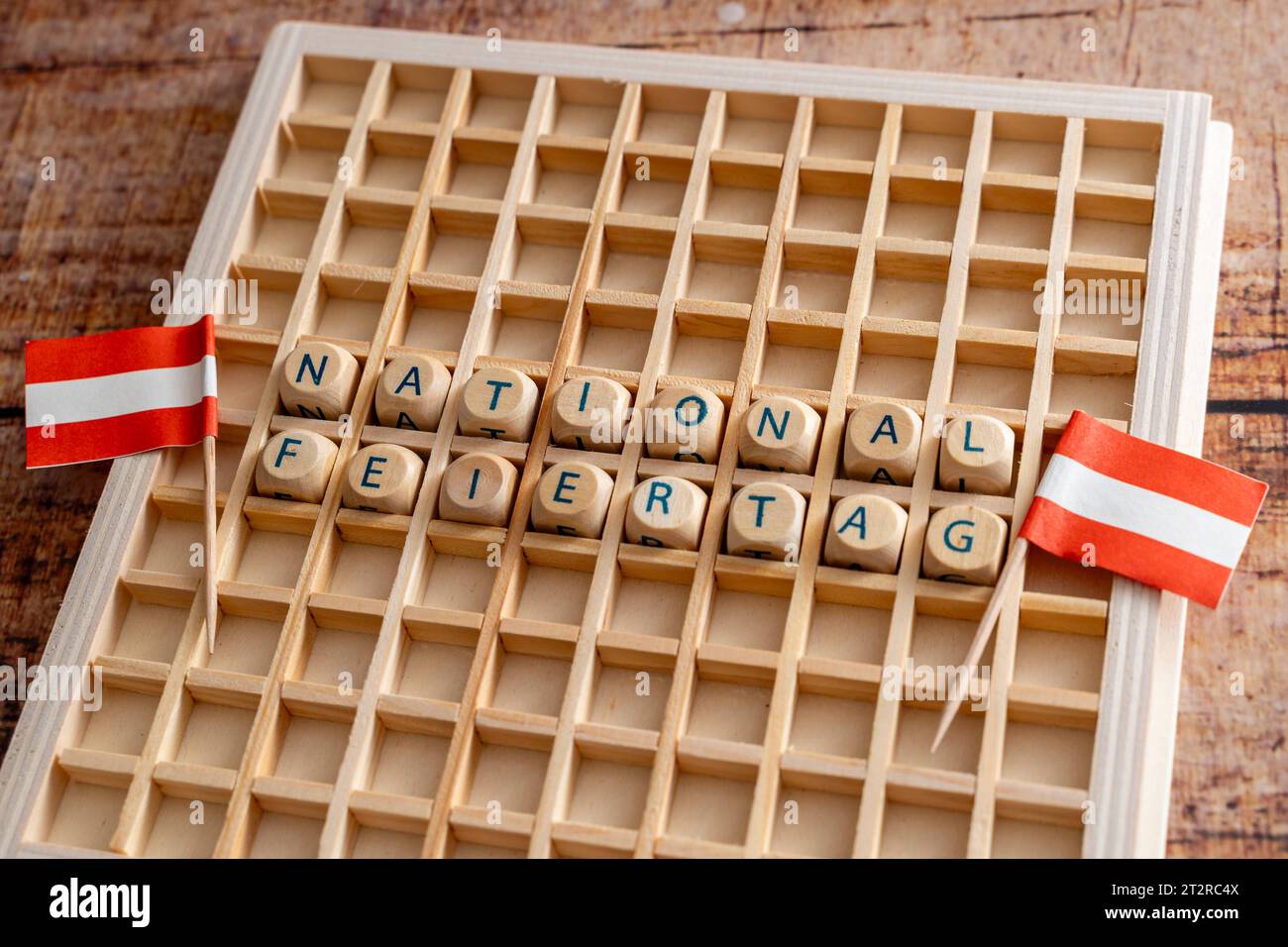 Letter cubes make the word National Day with Austrian flags. Symbol image National holiday on October 26 in, Austria. 21st Oct, 2023. *** Buchstabenwürfel ergeben das Wort Nationalfeiertag mit österreichischen Flaggen. Symbolbild National Feiertag am 26. Oktober in Österreich Credit: Imago/Alamy Live News Stock Photo