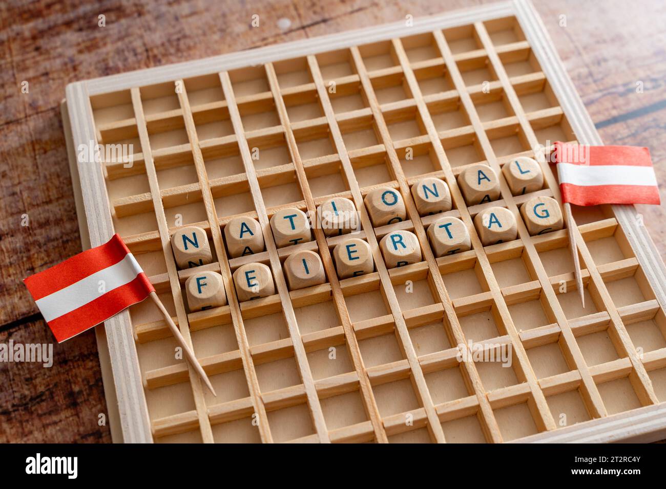 Letter cubes make the word National Day with Austrian flags. Symbol image National holiday on October 26 in, Austria. 21st Oct, 2023. *** Buchstabenwürfel ergeben das Wort Nationalfeiertag mit österreichischen Flaggen. Symbolbild National Feiertag am 26. Oktober in Österreich Credit: Imago/Alamy Live News Stock Photo