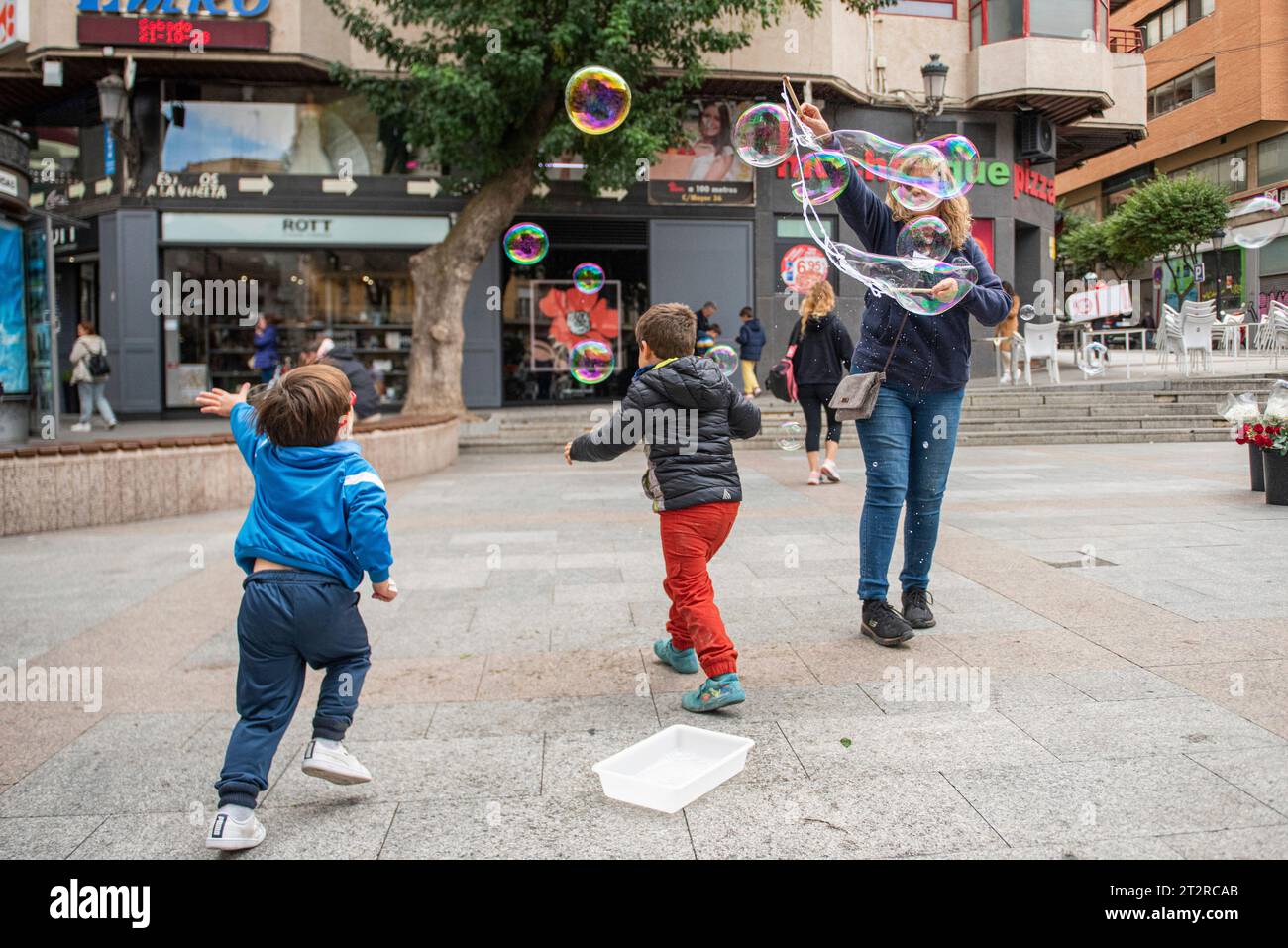 Two children play during the Breastfeeding Festival, in the Plaza Mayor