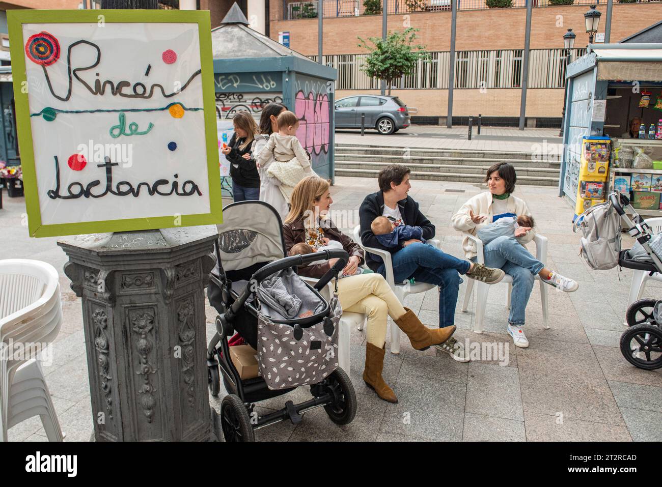Three women breastfeed their babies during the Breastfeeding Festival