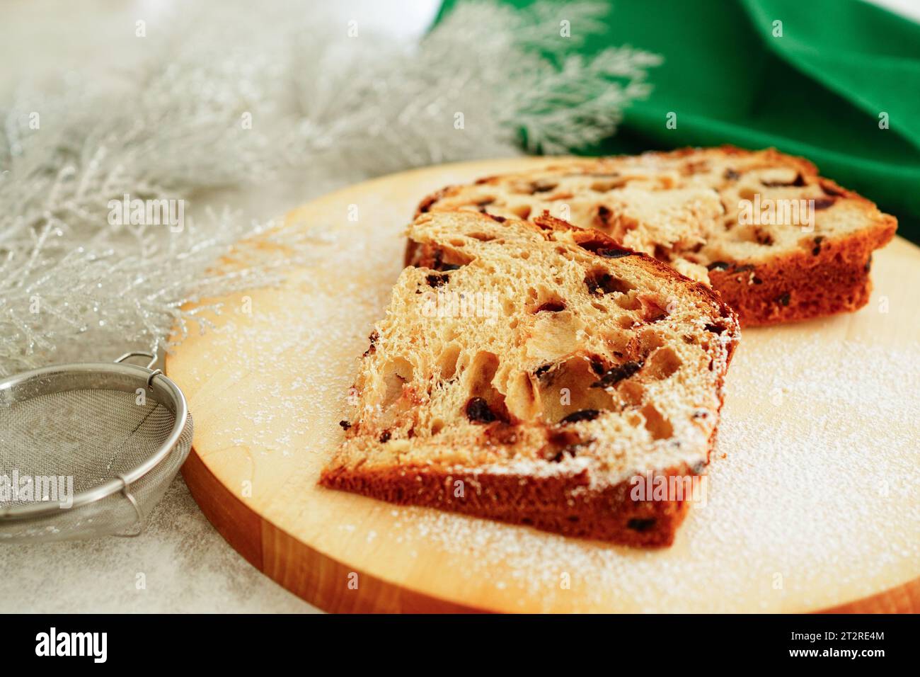 Cut panettone  on wooden board, Italian traditional Christmas cake Stock Photo