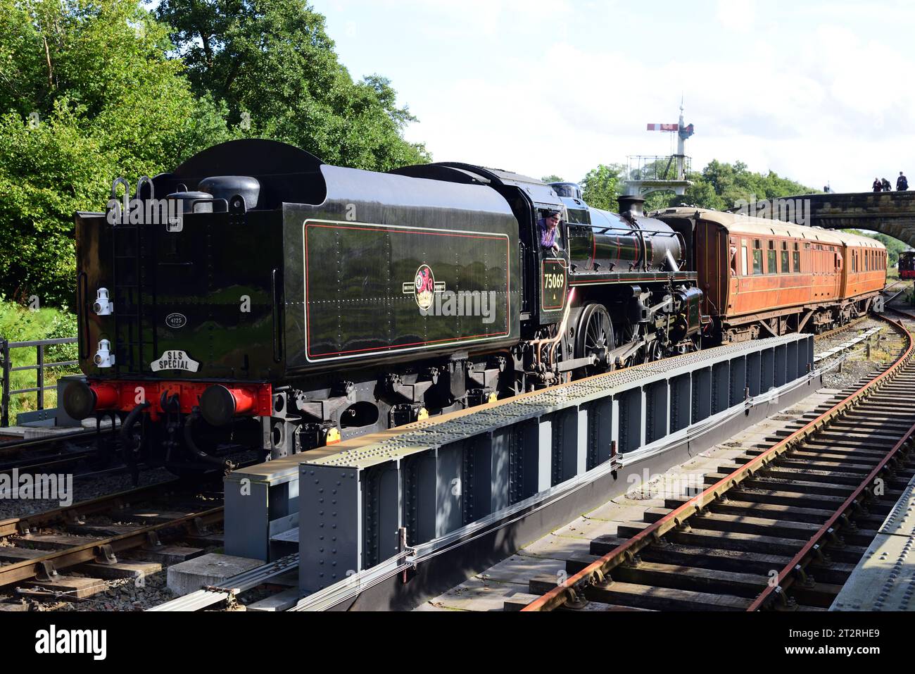 Running tender first, BR Standard Class 4 No 75069 arrives at Goathland on the North Yorkshire Moors Railway during its 50th anniversary gala. Stock Photo