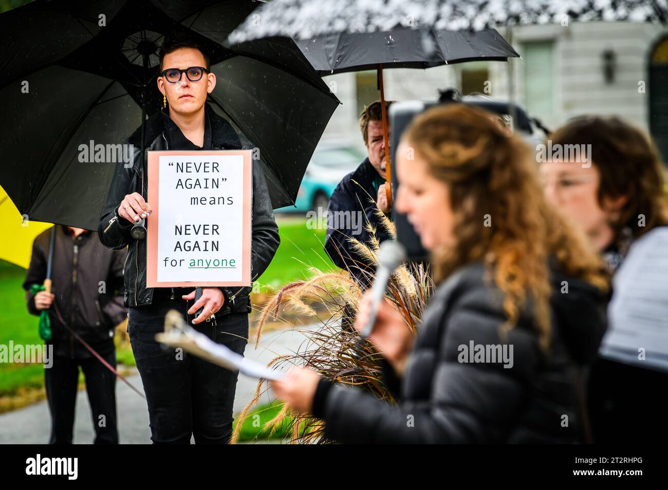 Montpelier, USA. 20th October, 2023. Participant holds sign referring to Holocaust during a gathering at the Vermont State House in Montpelier, VT, USA, to mourn the victims of strife in Israel and Gaza. Credit: John Lazenby/Alamy Live News Stock Photo