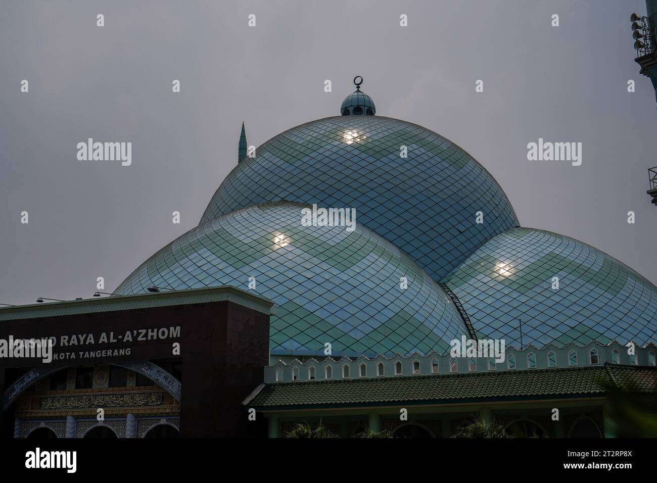 Indonesian. The mosque is the place where Muslims worship, located from the side with a view towards the sky. Stock Photo