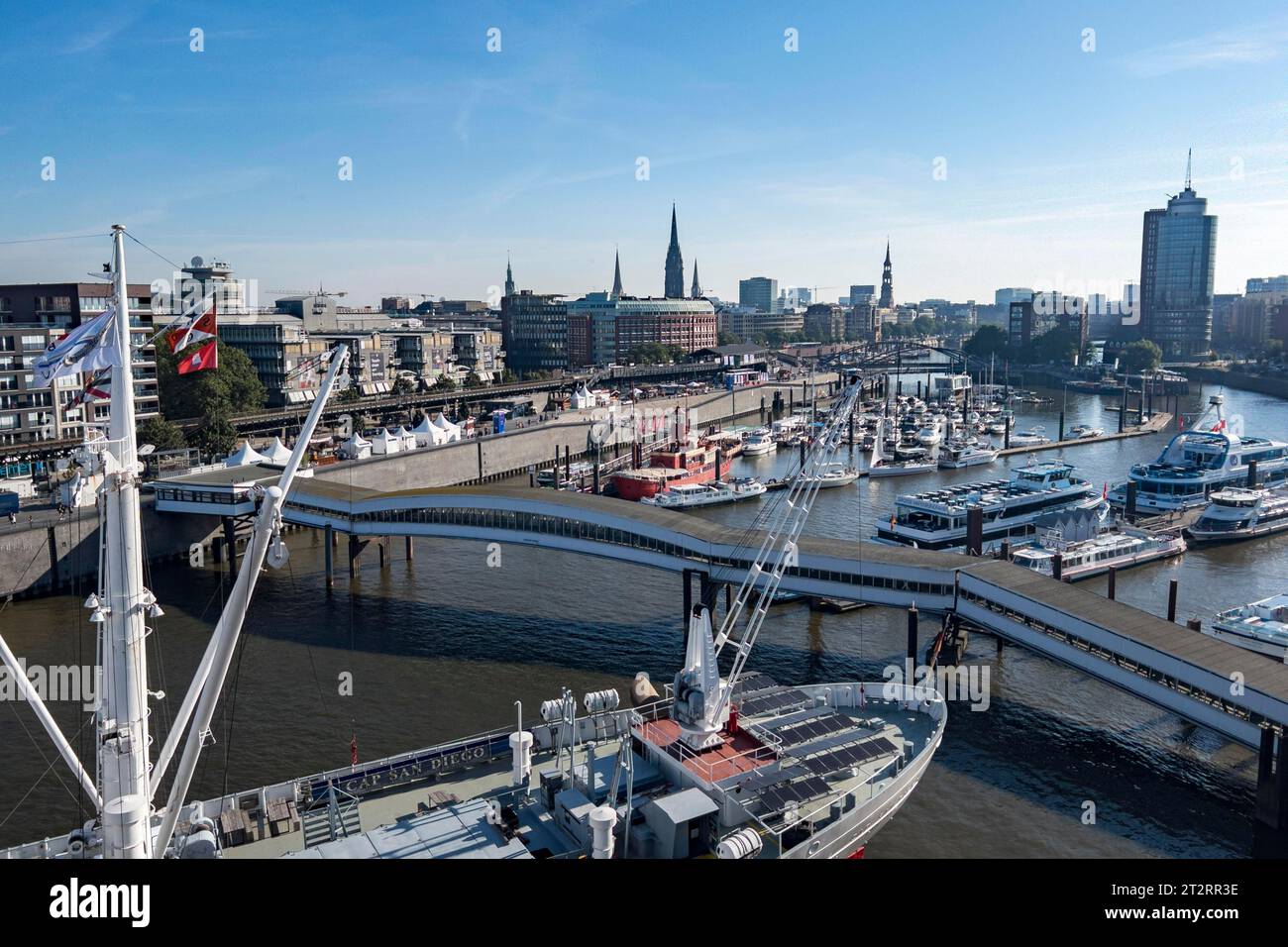 View of Niederhafen harbour and the museum ship Cap San Diego at the Ueberseebruecke bridge in the Port of Hamburg from a cruise ship Stock Photo
