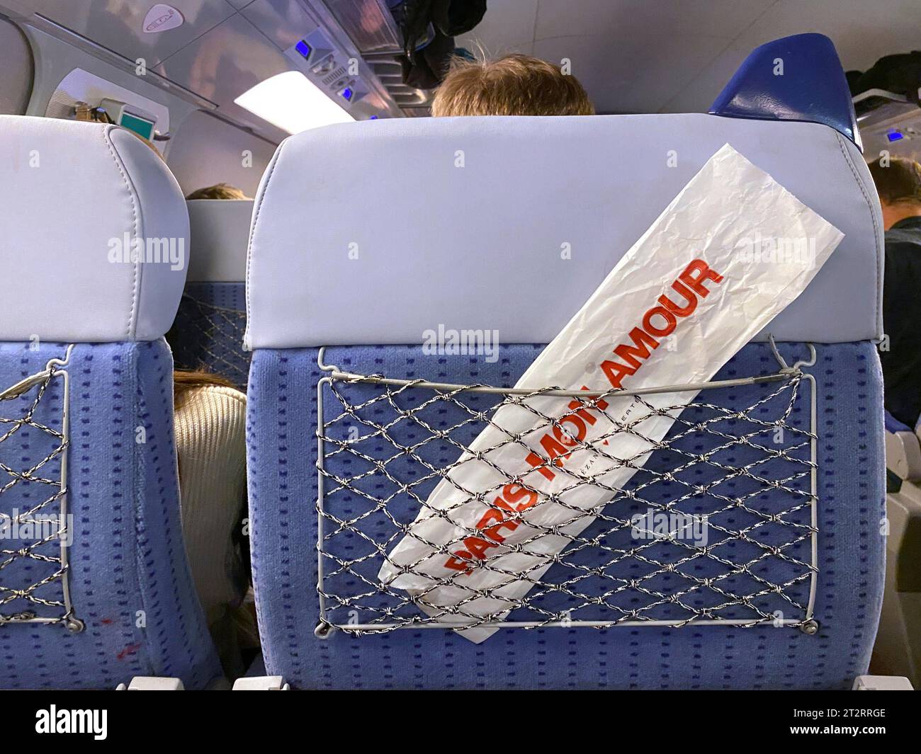 Baguette bag with inscription PARIS MON AMOUR, PARIS MY LOVE, in luggage net, TGV, SNCF high-speed train, Paris, France Stock Photo