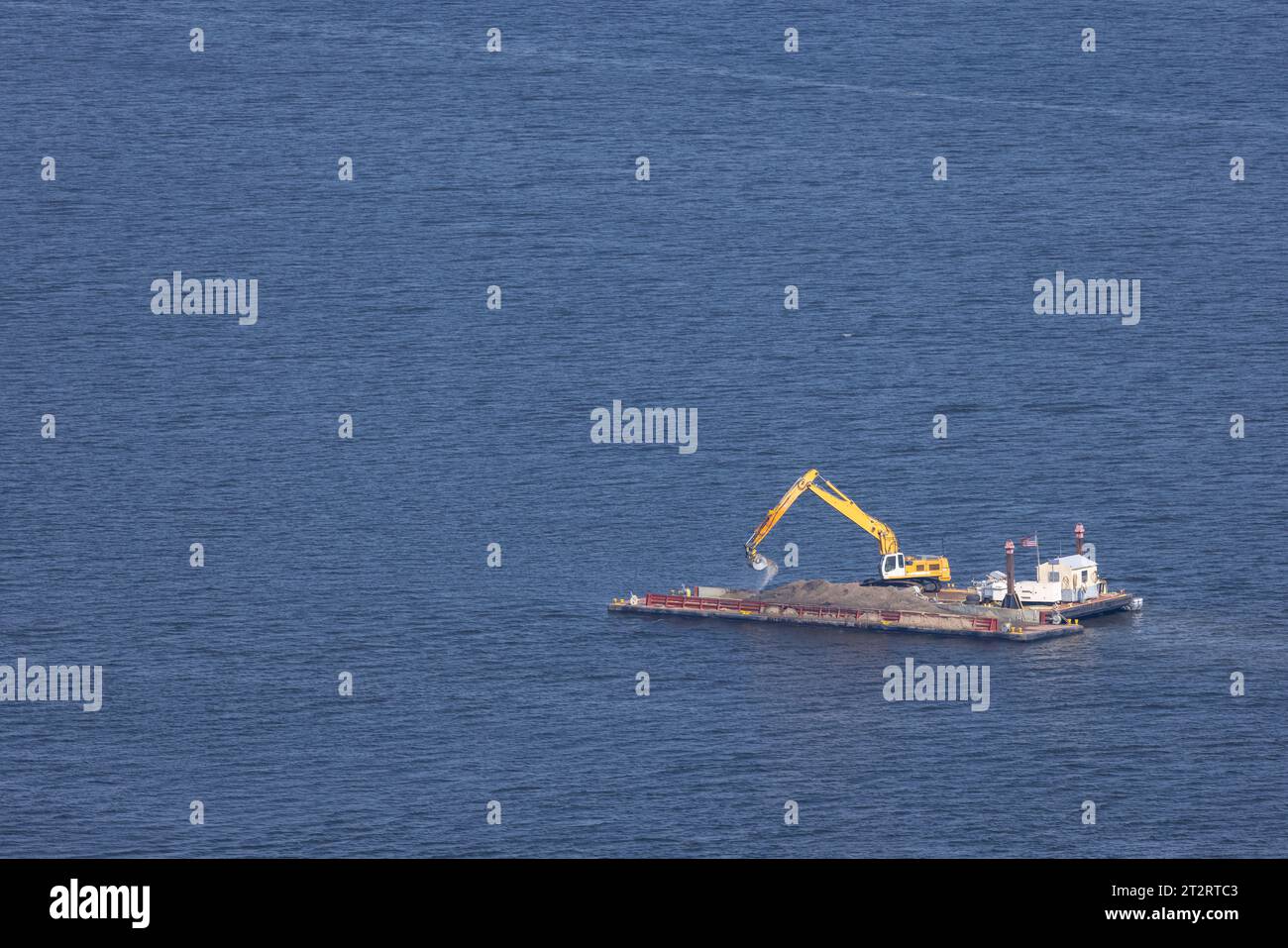 A dredging barge at work on the Mississippi River. Stock Photo