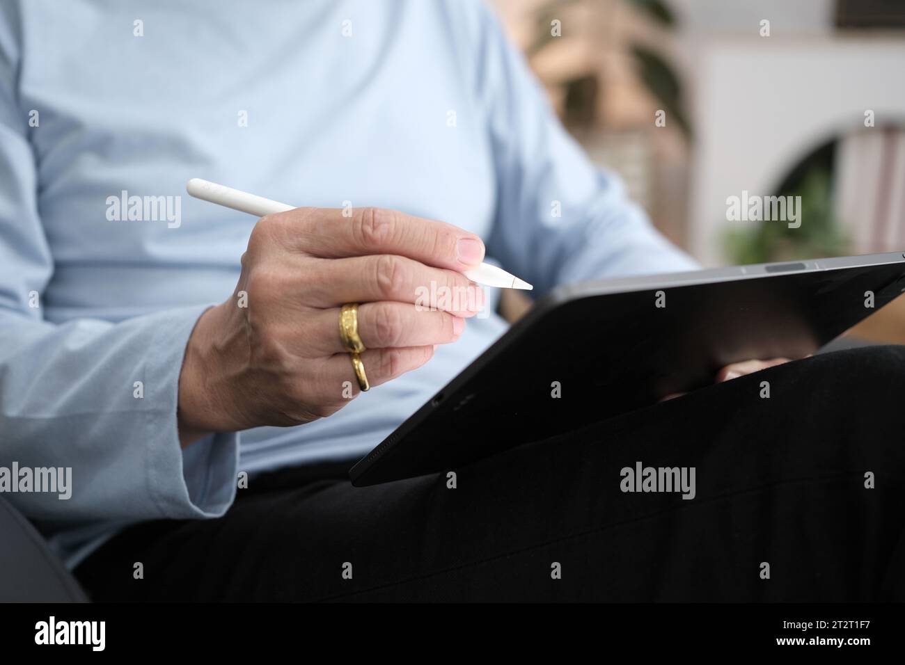 Hands of senior man using tablet PC. Stock Photo