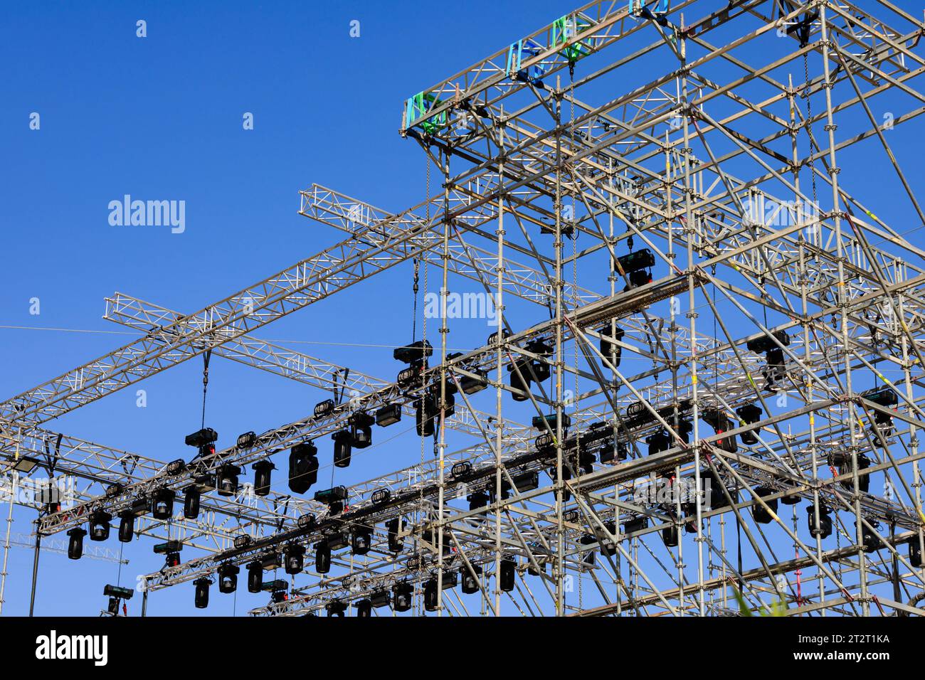 Outdoor scaffolding stage lighting rig for a concert against a clear blue sky. Larnaca, Cyprus Stock Photo