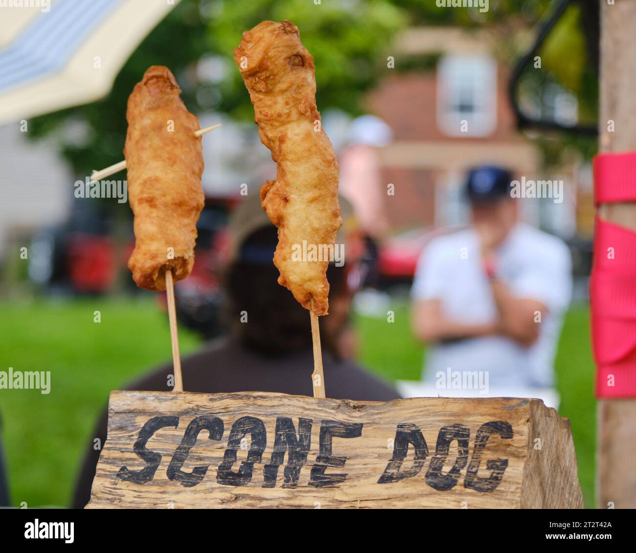Scone Dogs, sausage wrapped in Bannock fried, on display to be picked up Stock Photo