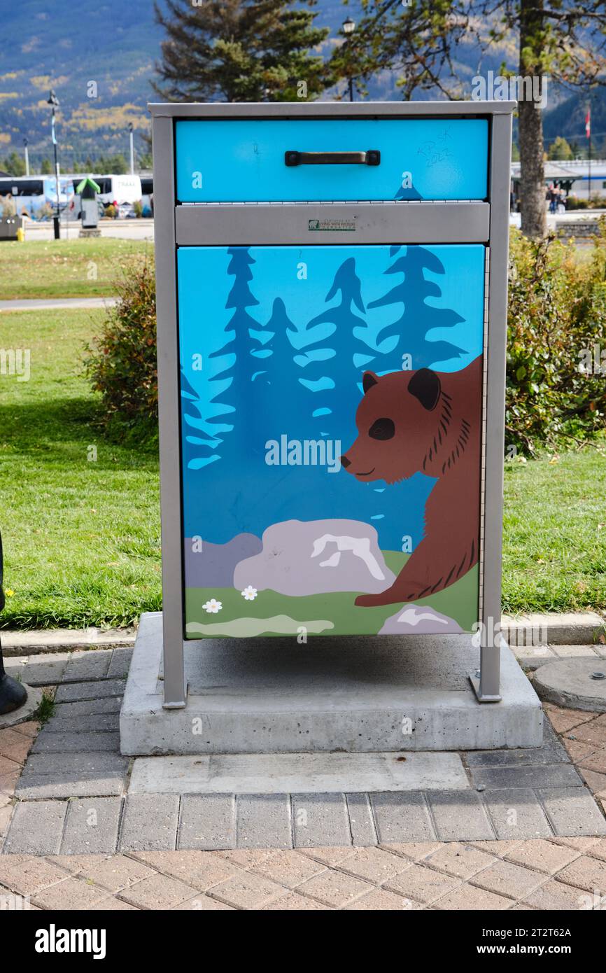 bear proof garbage can in Jasper, with bear drawing Stock Photo