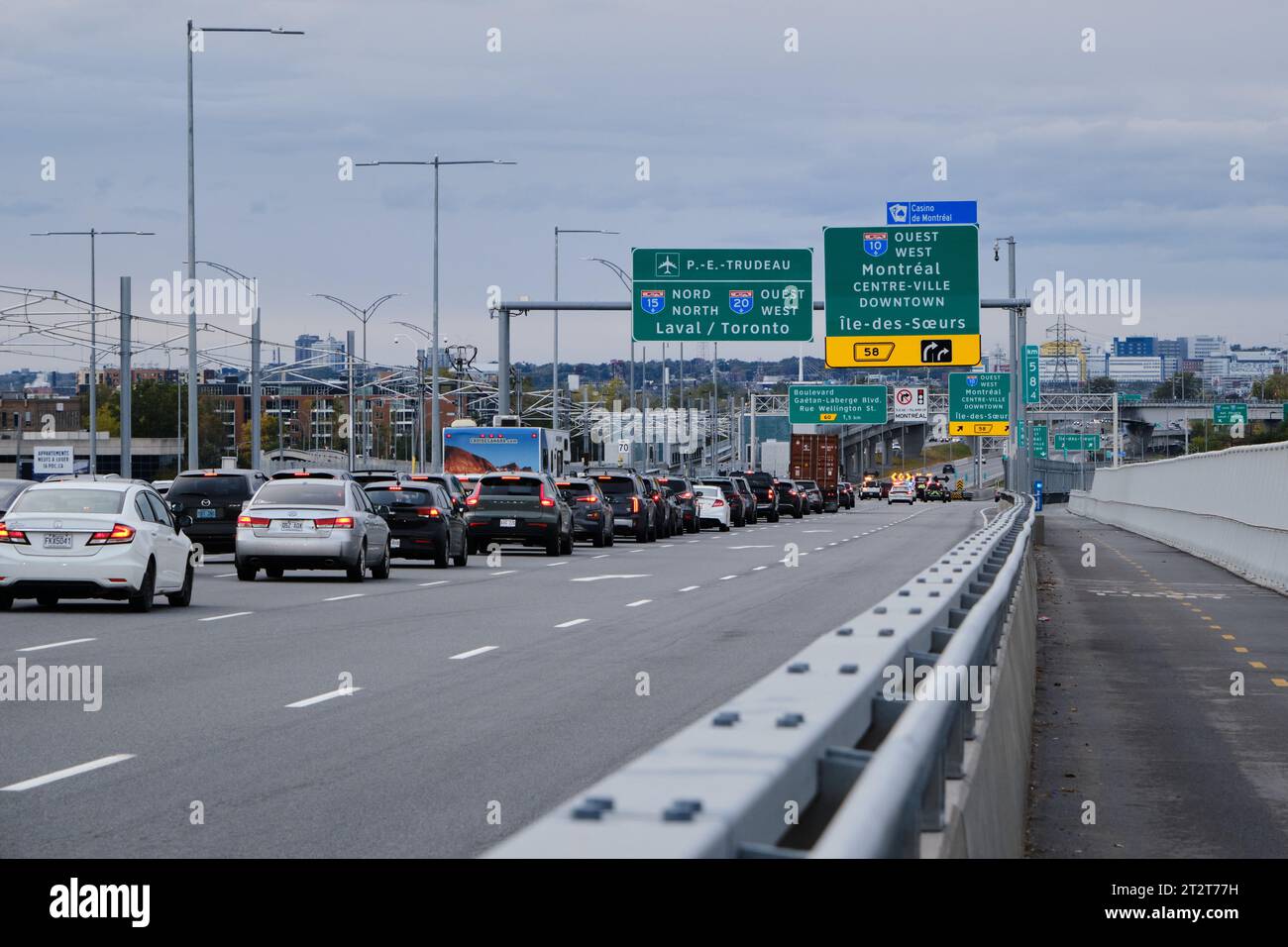 traffic jam on Champlain Bridge coming into Montreal following an accident, with cars stopped before exit. Stock Photo