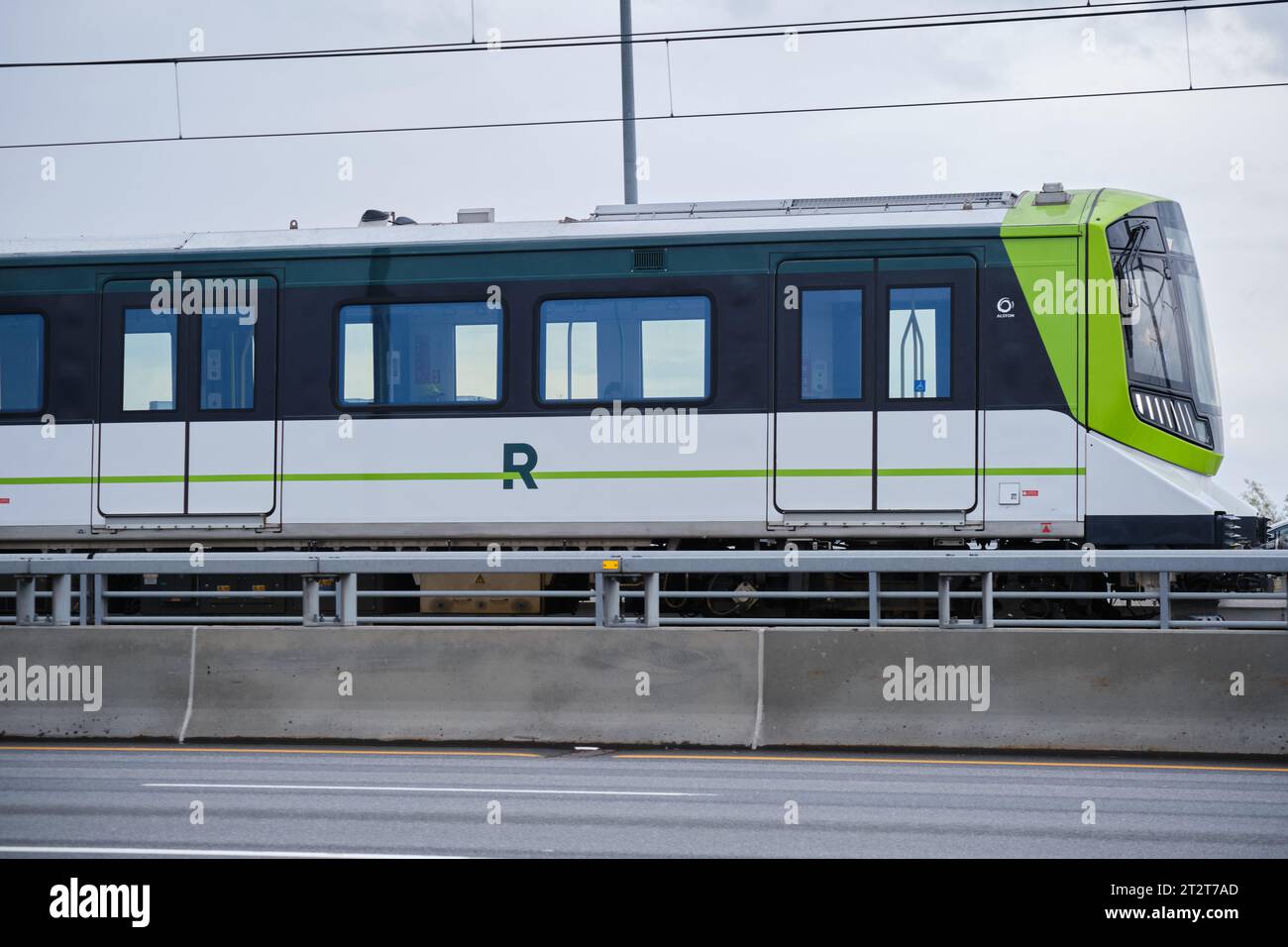 New REM light rail transit train going along Champlain bridge Stock Photo