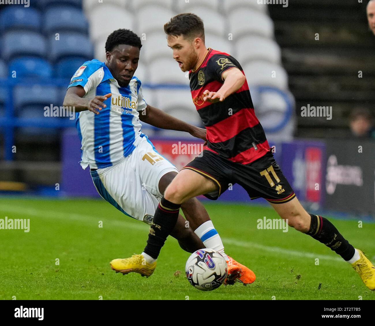 Jaheim Headley #15 of Huddersfield Town competes for the ball with Paul ...