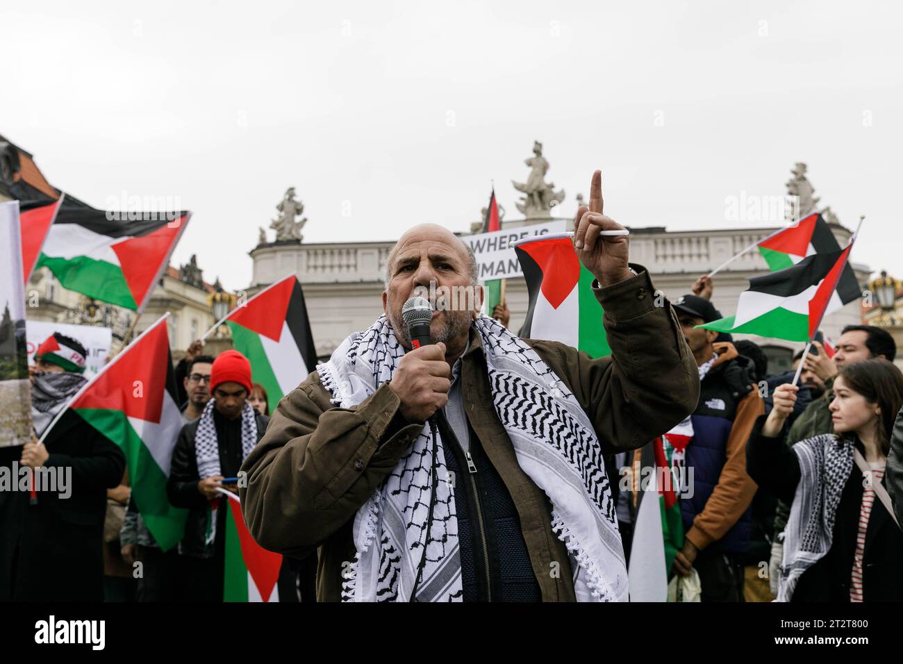 A man seen delivering a speech in front of the Presidential Palace