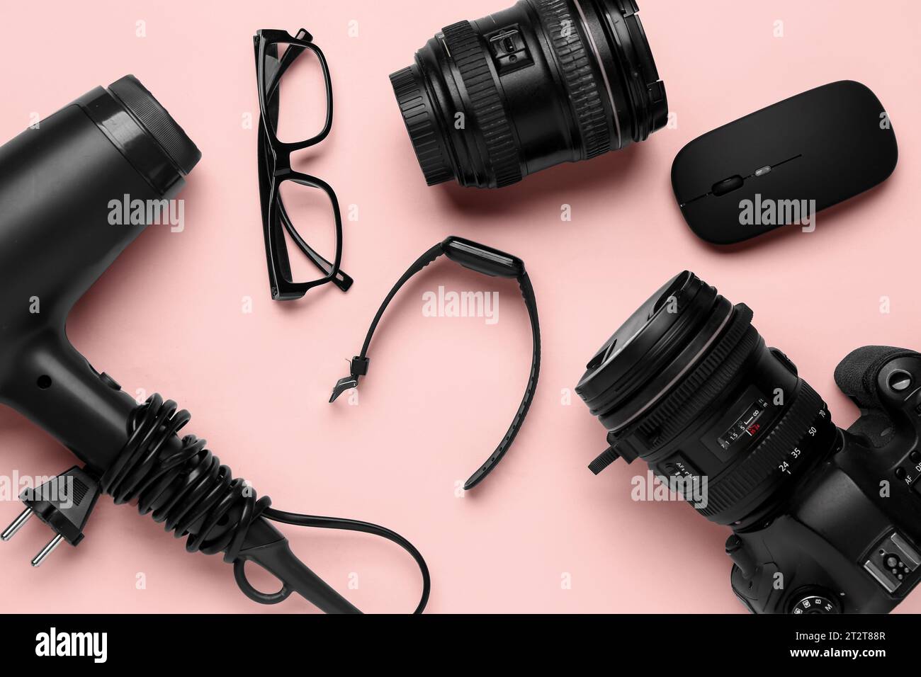 Modern gadgets on pink background Stock Photo