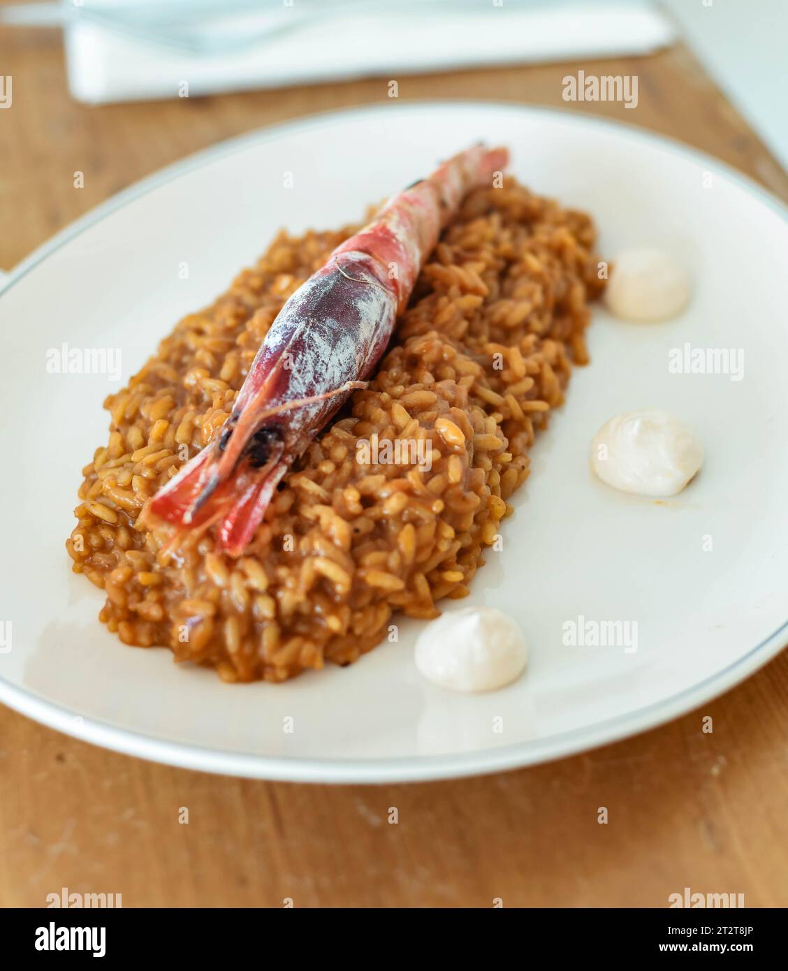 Gourmet rice dish with coastal shrimp Stock Photo