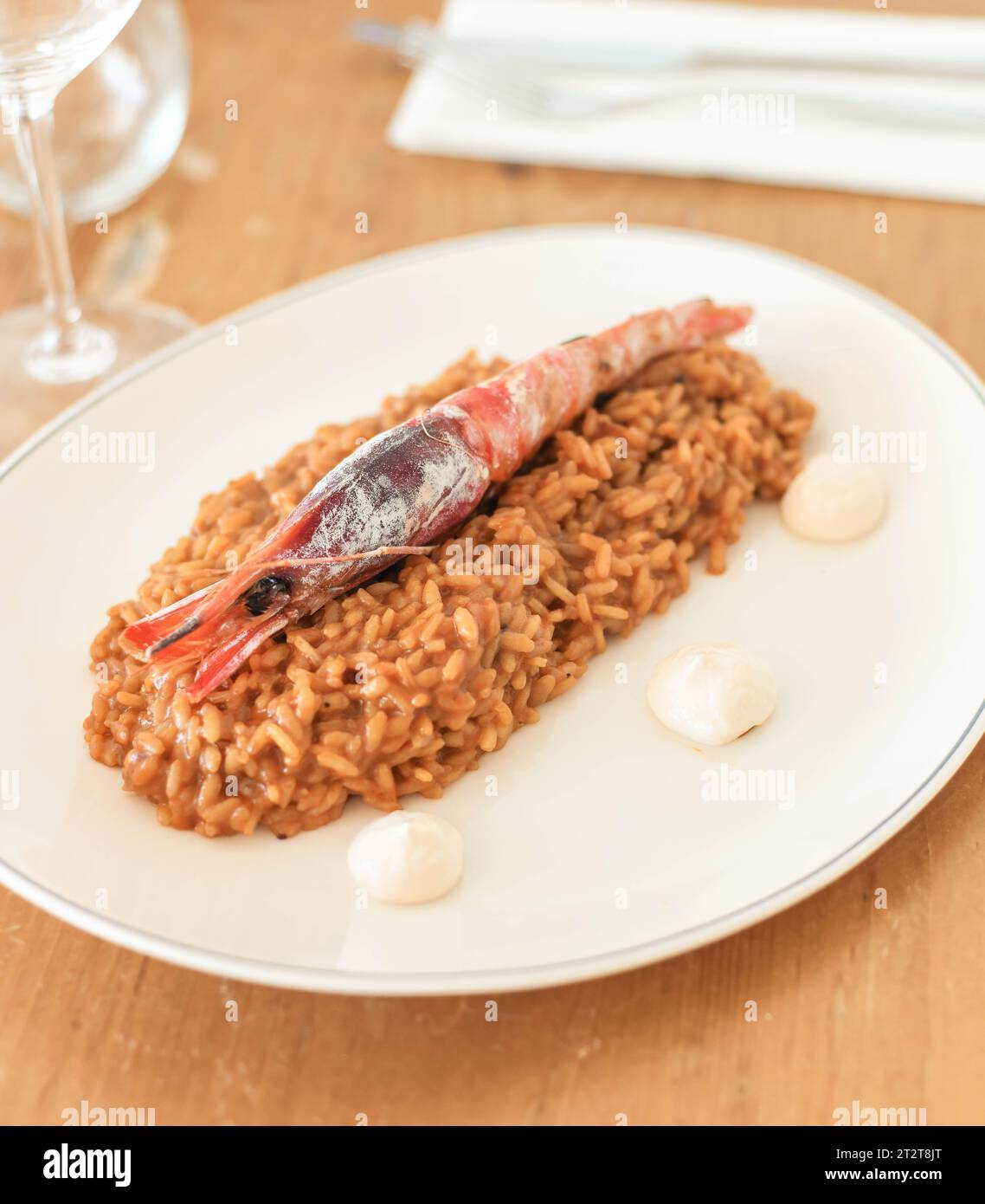 Gourmet rice dish with coastal shrimp Stock Photo