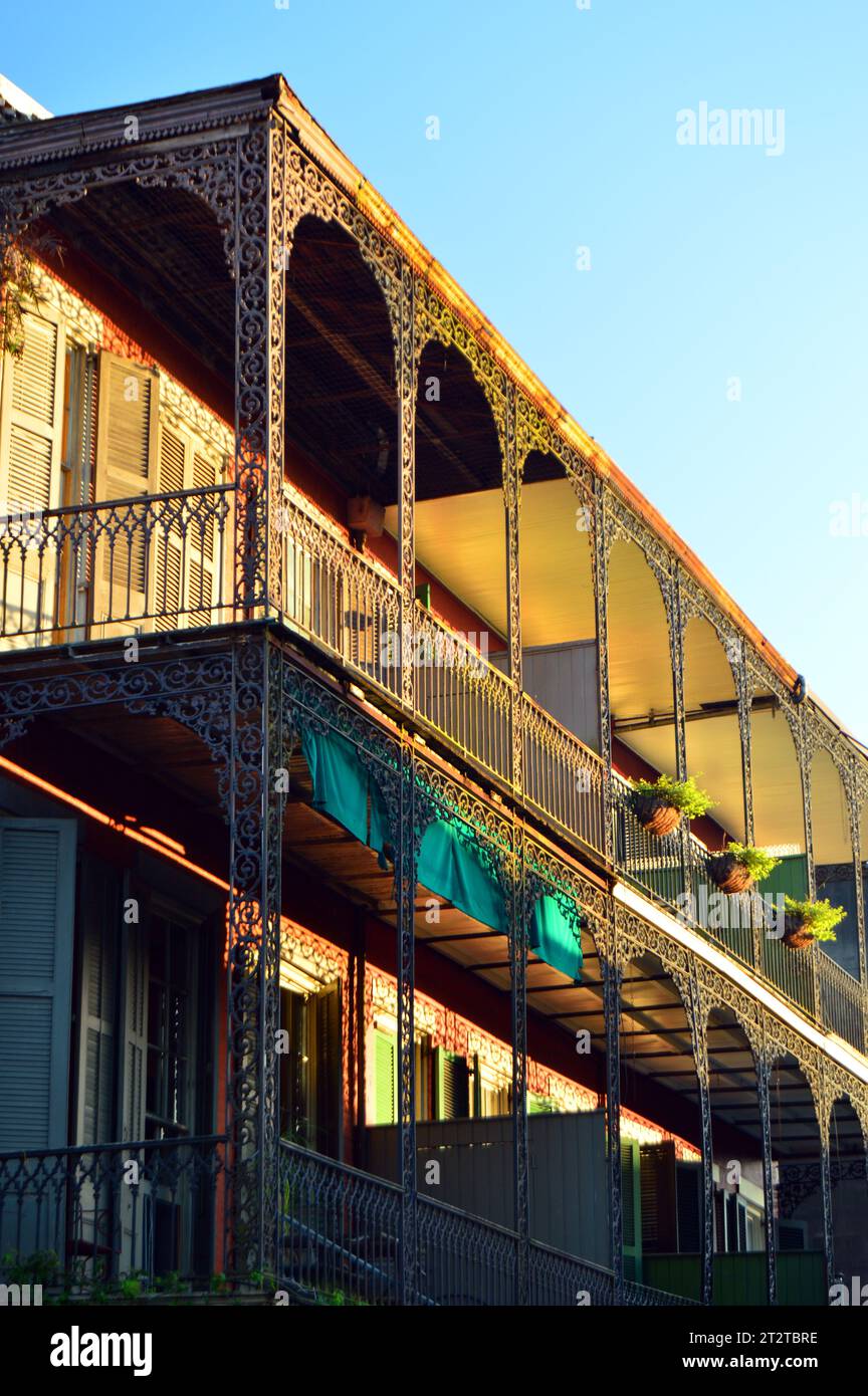 Wrought iron railings decorate a balcony and gallery in the French Quarter of New Orleans Stock Photo
