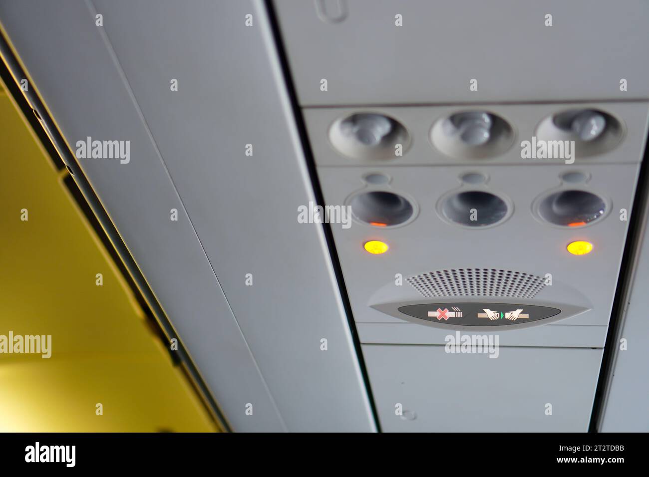 Close-up of Seat Belt Warning Light on Airplane Stock Photo