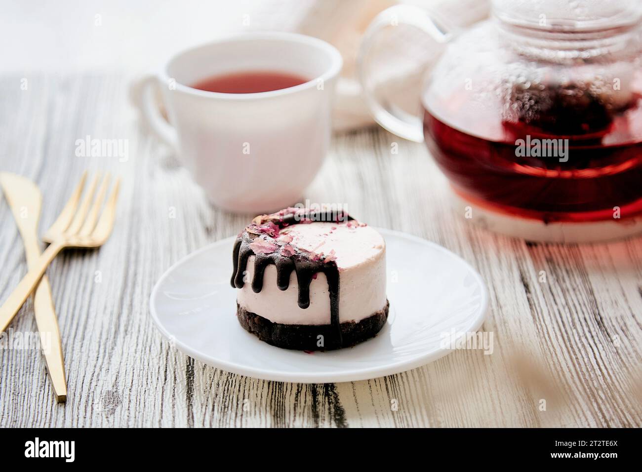 Raspberry vegan gluten and sugar free cake with carob near berries organic tea. Healthy breakfast. Stock Photo