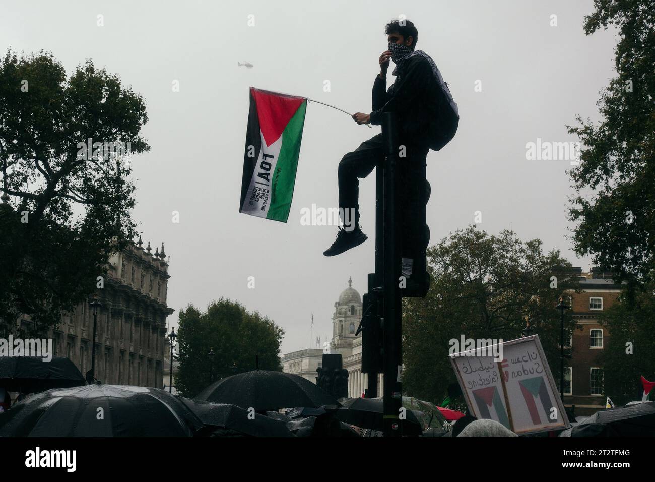 London, UK. 21st October 2023.  A March for Palestine and Gaza in Central London sees thousands attend, the harsh rain not dissuading the emotive displays of passion, anger, sorrow, and solidarity: groups from Stop the War Coalition, Members of the Neturei Karta Jewish Community, Friends of Al Aqsa, and others joined together to decry the situation unfolding in the Middle East. © Simon King/ Alamy Live News Stock Photo