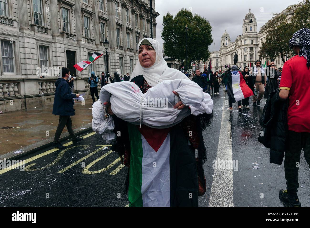 London, UK. 21st October 2023.  A March for Palestine and Gaza in Central London sees thousands attend, the harsh rain not dissuading the emotive displays of passion, anger, sorrow, and solidarity: groups from Stop the War Coalition, Members of the Neturei Karta Jewish Community, Friends of Al Aqsa, and others joined together to decry the situation unfolding in the Middle East. © Simon King/ Alamy Live News Stock Photo