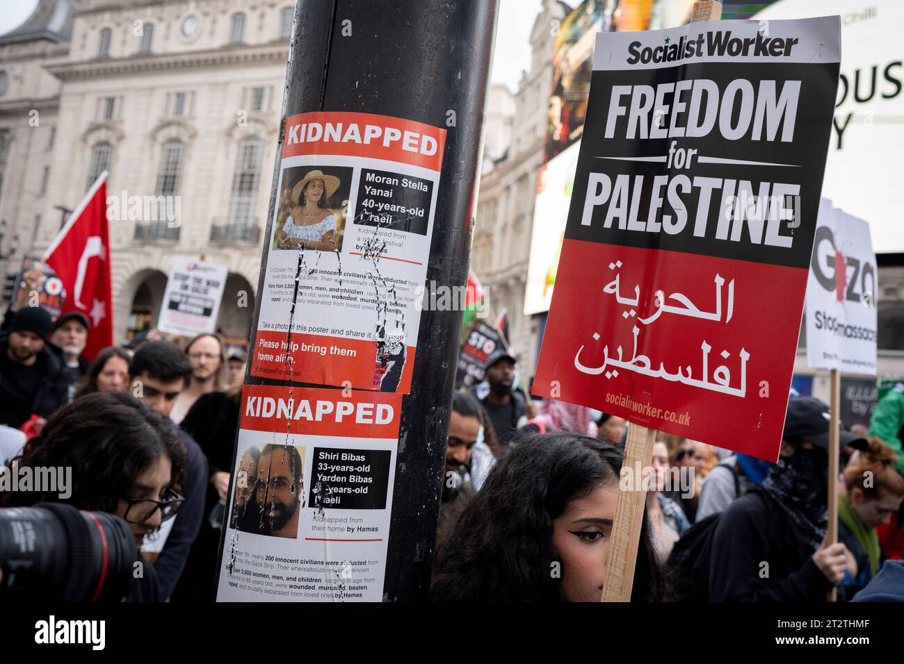 A missing person poster of a kidnapped Israeli woman is seen on a post as pro-Palestinian protesters march through central London for the second consecutive week after the attacks by Hamas on Israel, on 21st October 2023, in London, England. Met Police have estimated that 100,000 took part in the protest through the capital, the second such mass event in a week. Stock Photo