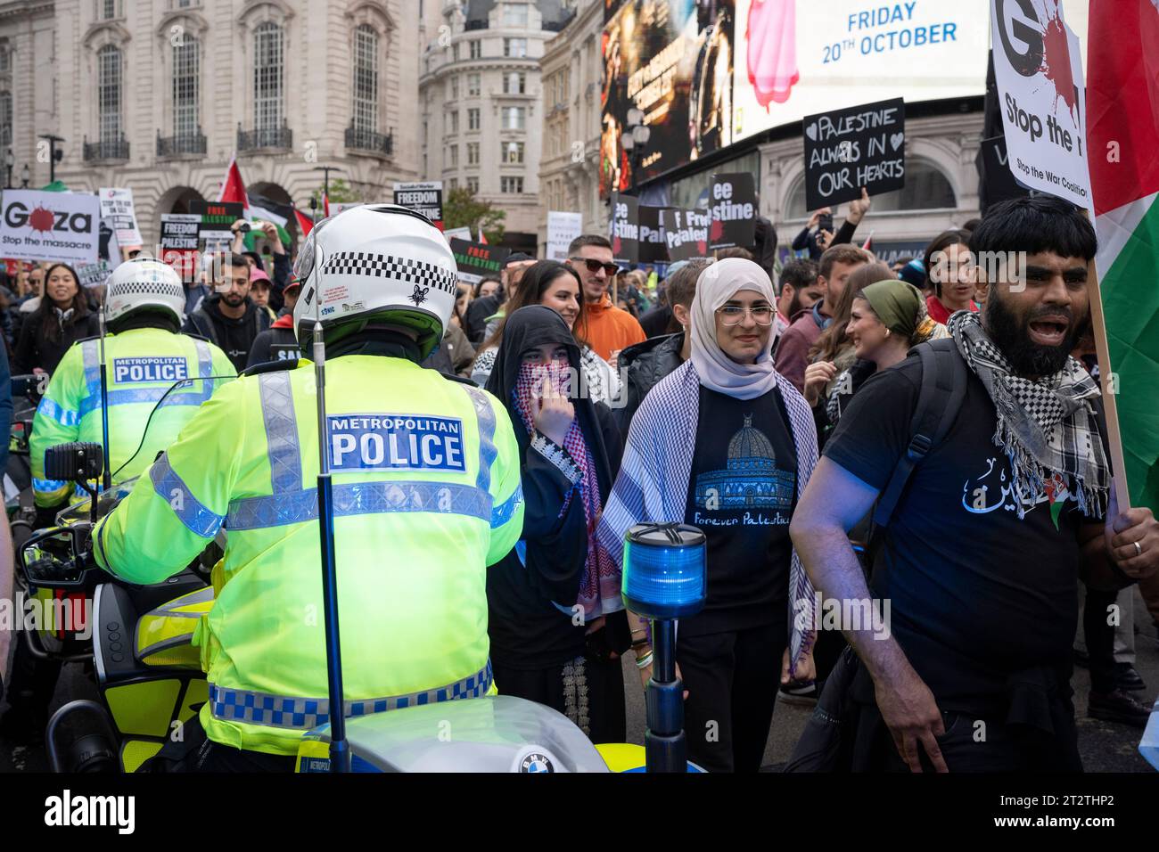 Met Police officers on bikes as pro-Palestinian protesters march through central London for the second consecutive week after the attacks by Hamas on Israel, on 21st October 2023, in London, England. Met Police have estimated that 100,000 took part in the protest through the capital, the second such mass event in a week. Stock Photo