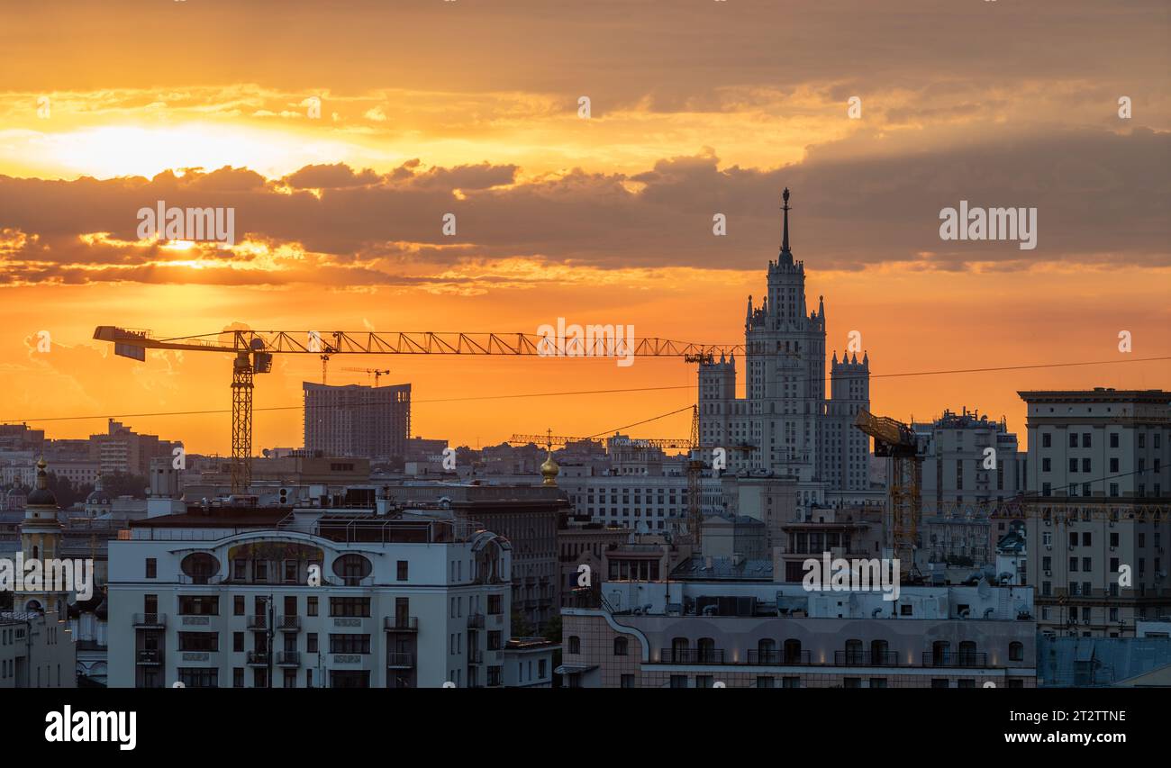 July 10, 2022. Moscow, Russia. A high-rise on Kotelnicheskaya embankment and a construction crane in the center of the Russian capital at dawn. Stock Photo