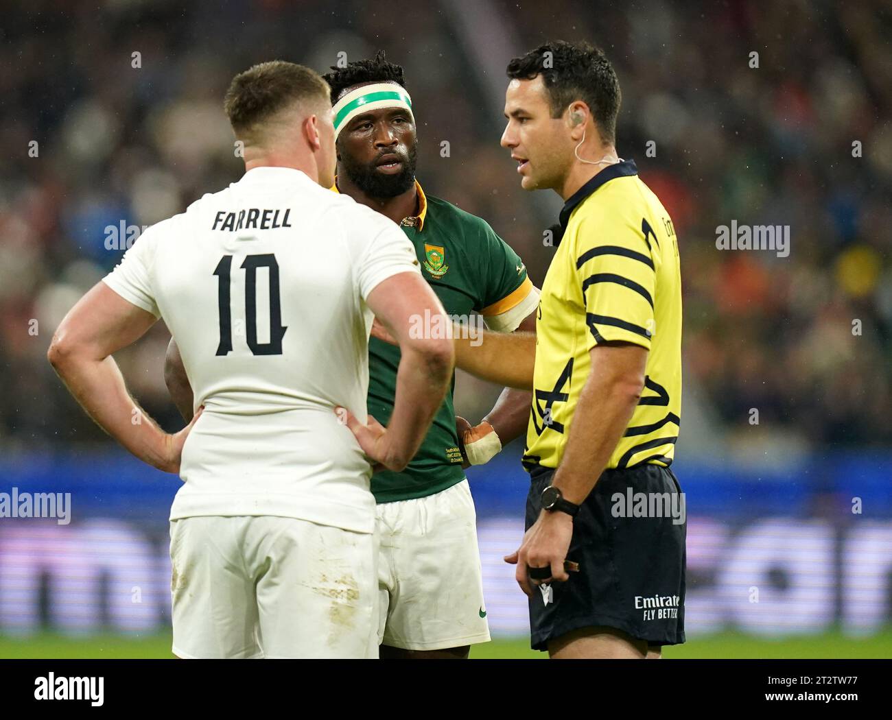Referee Ben O’Keeffe speaks with England's Owen Farrell (left) and