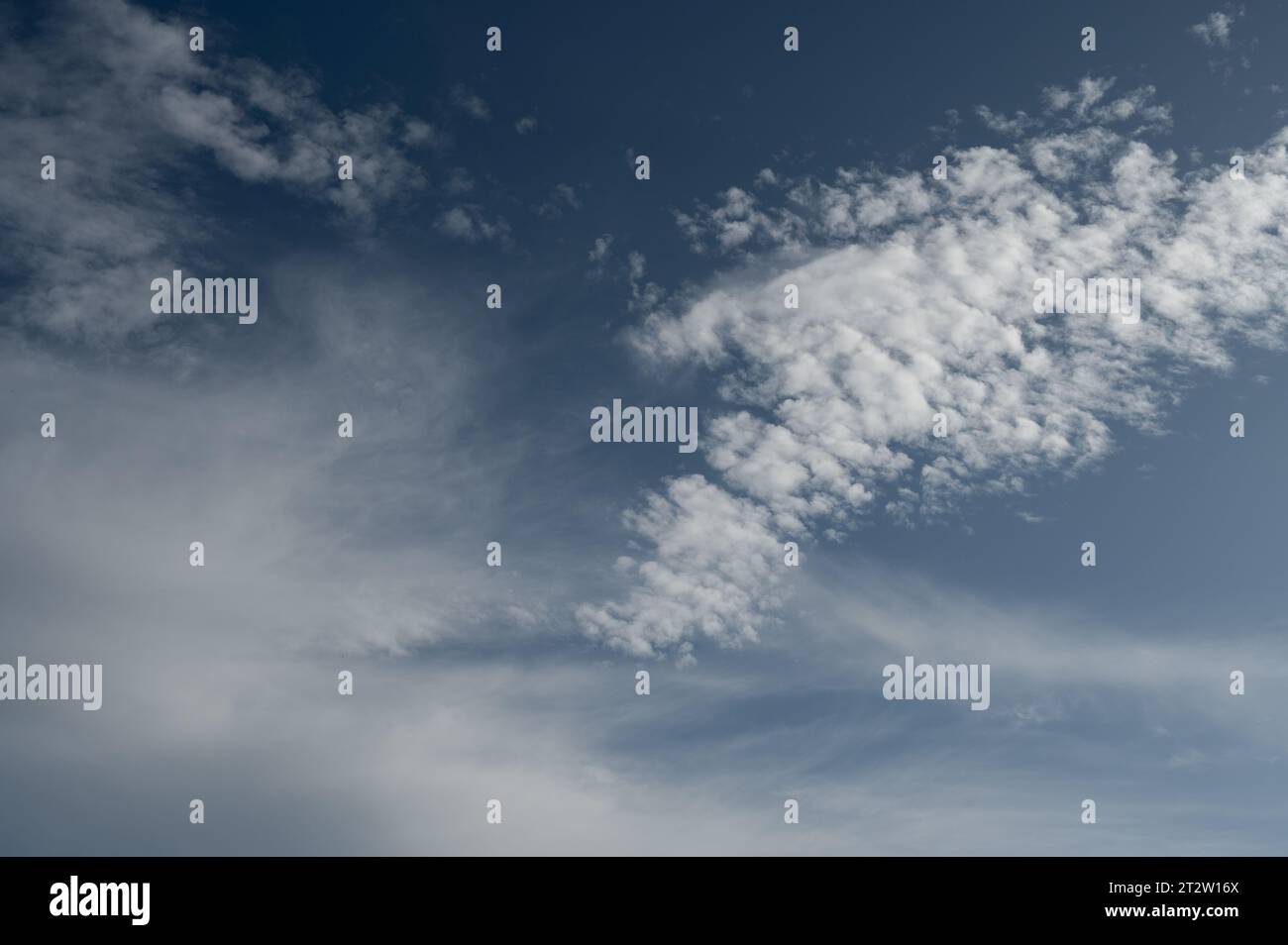 Clouds in the sky. The wonderful spectacle of a sky full of clouds. Depth and three-dimensionality of a cloudy sky. Stock Photo