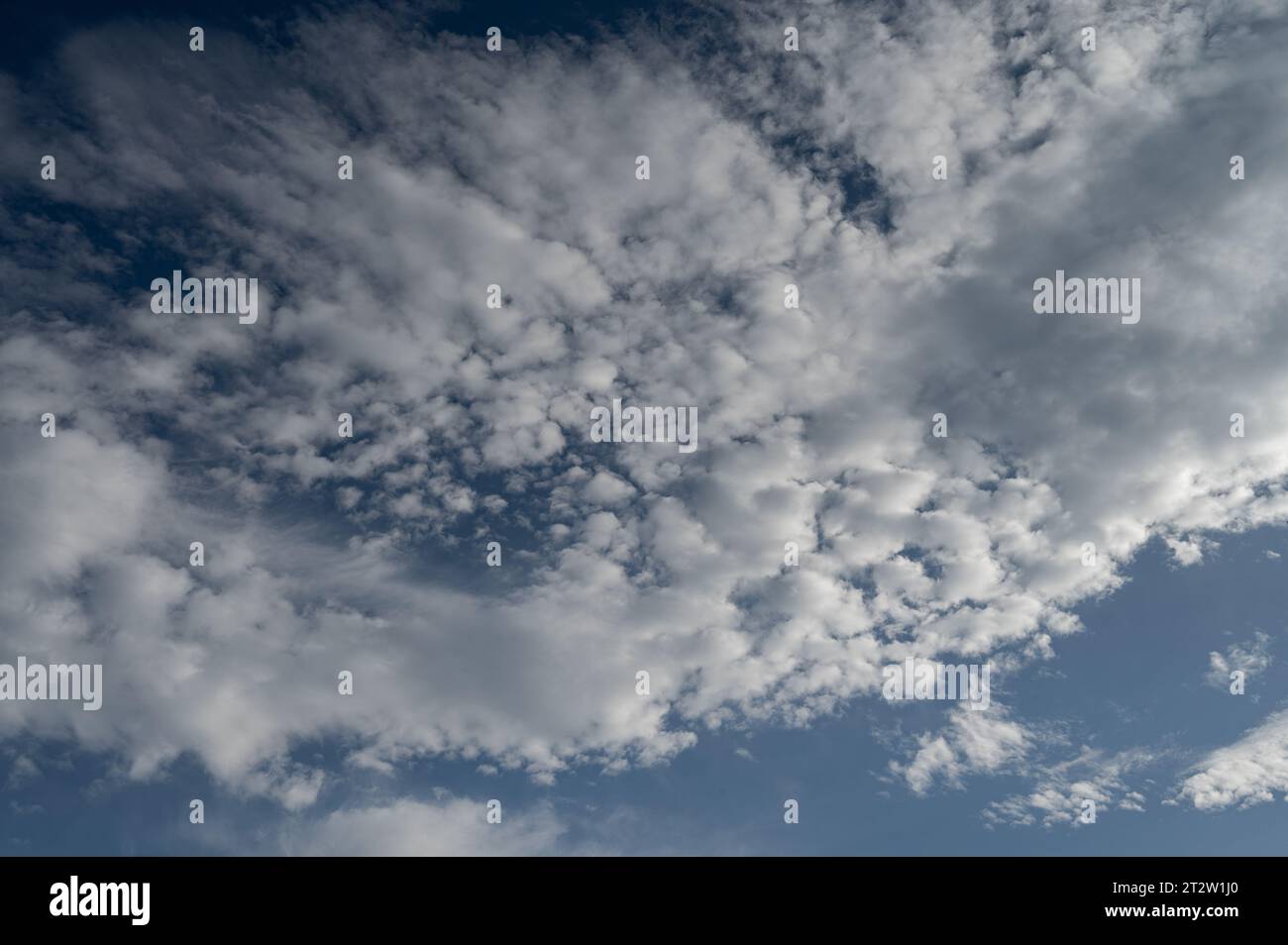 Clouds in the sky. The wonderful spectacle of a sky full of clouds. Depth and three-dimensionality of a cloudy sky. Stock Photo