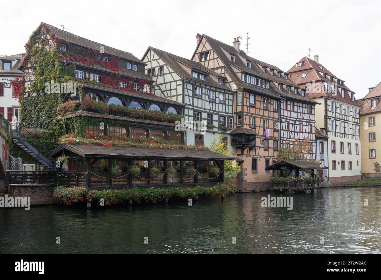 View of the Tanner's Quarter with colored half-timbered buildings and the river Ill Stock Photo