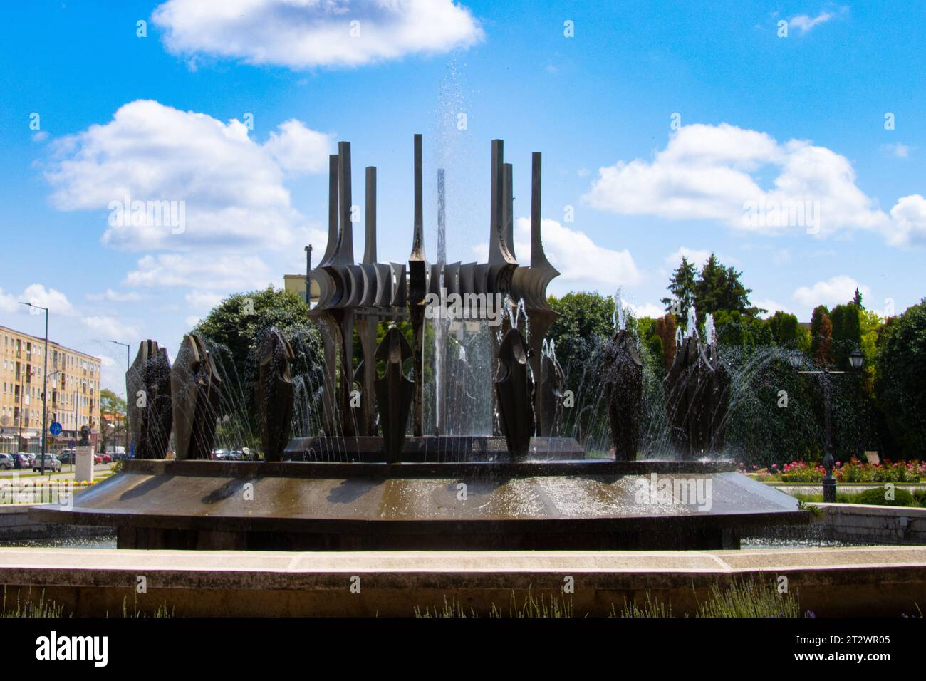 Water fountain on a summer day in the center of Carei, Satu Mare county, Romania Stock Photo