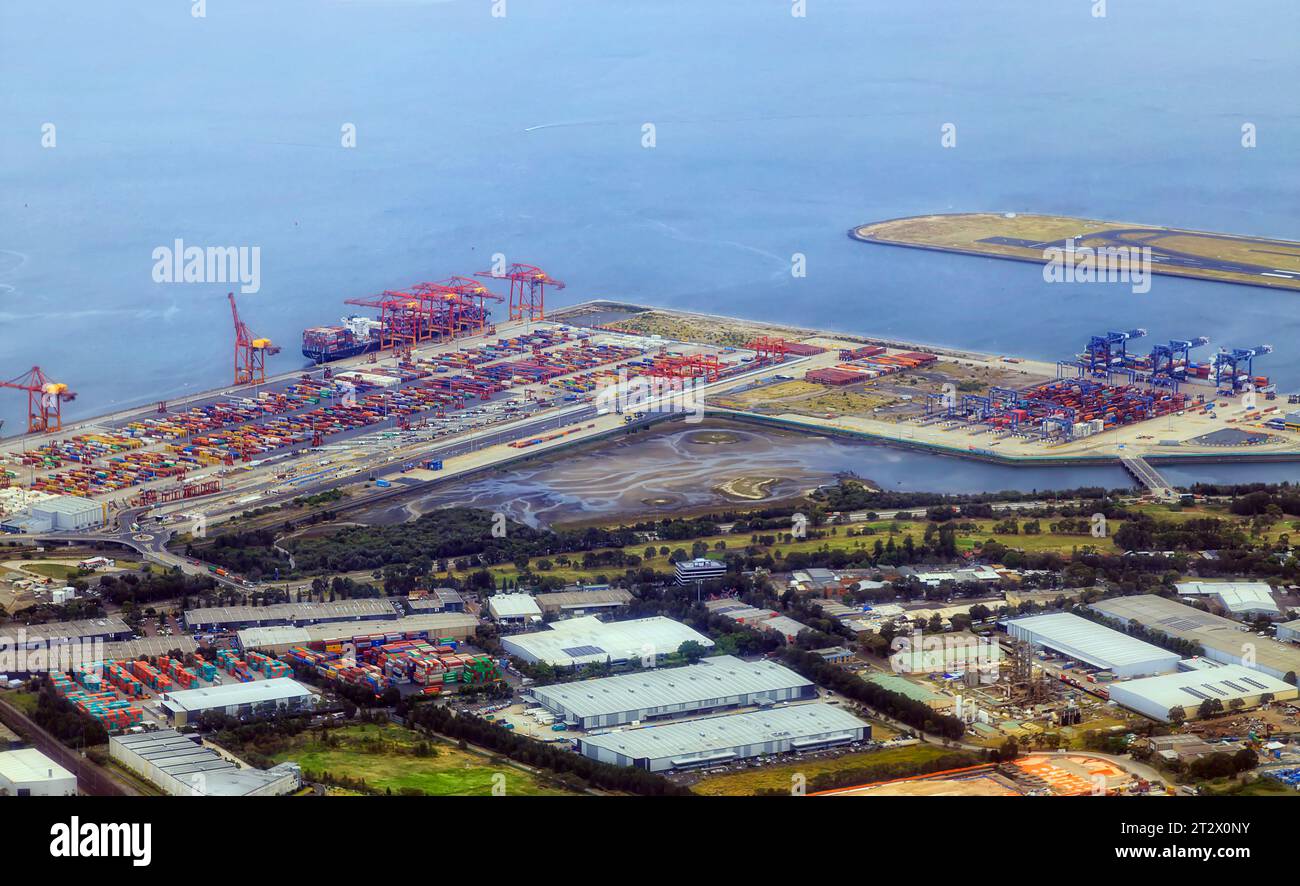 Botany bay airport and cargo shipment transport terminal in Sydney city - aerial view. Stock Photo