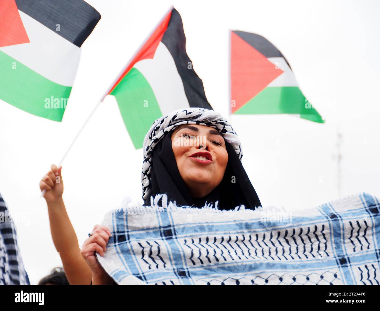 Lima, Peru. 21st Oct, 2023. Islamic women waving Palestinian flags when hundreds of demonstrators, summoned by the Boycott, Divestment, Sanctions (BDS) movement, took to the streets in Lima, in support of the Palestinian people and against the Israel - Hamas war in the Gaza Strip. Credit: Fotoholica Press Agency/Alamy Live News Stock Photo