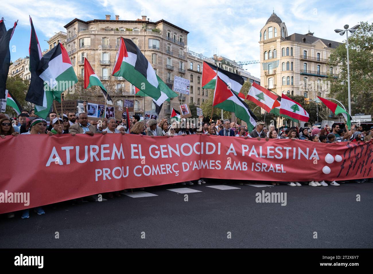 Barcelona, Spain. 21st Oct, 2023. The unity banner with the slogan stop the genocide of Palestine is seen during the demonstration. Some 80,000 people have demonstrated on Barcelona's Passeig de Gràcia against the genocide of the Palestinian people by the Israeli military forces. (Photo by Paco Freire/SOPA Images/Sipa USA) Credit: Sipa USA/Alamy Live News Stock Photo