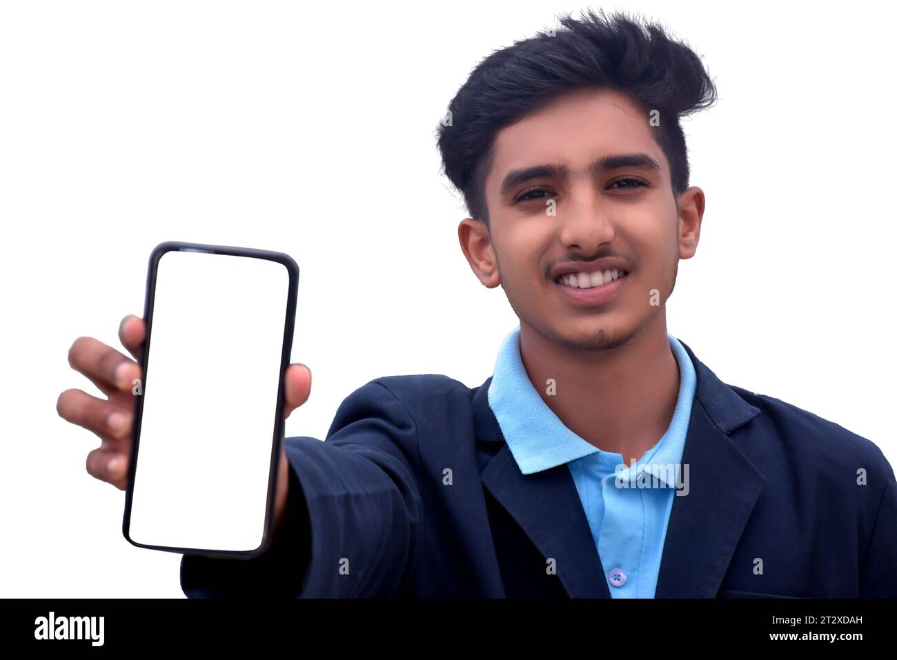 06-01-2022, Dewas, Madhya Pradesh, India. handsome teenage school boy showing smartphone in india, isolated white background Stock Photo